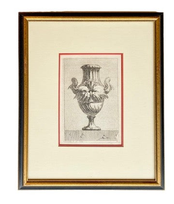 Framed artwork of a classical vase design on a white background