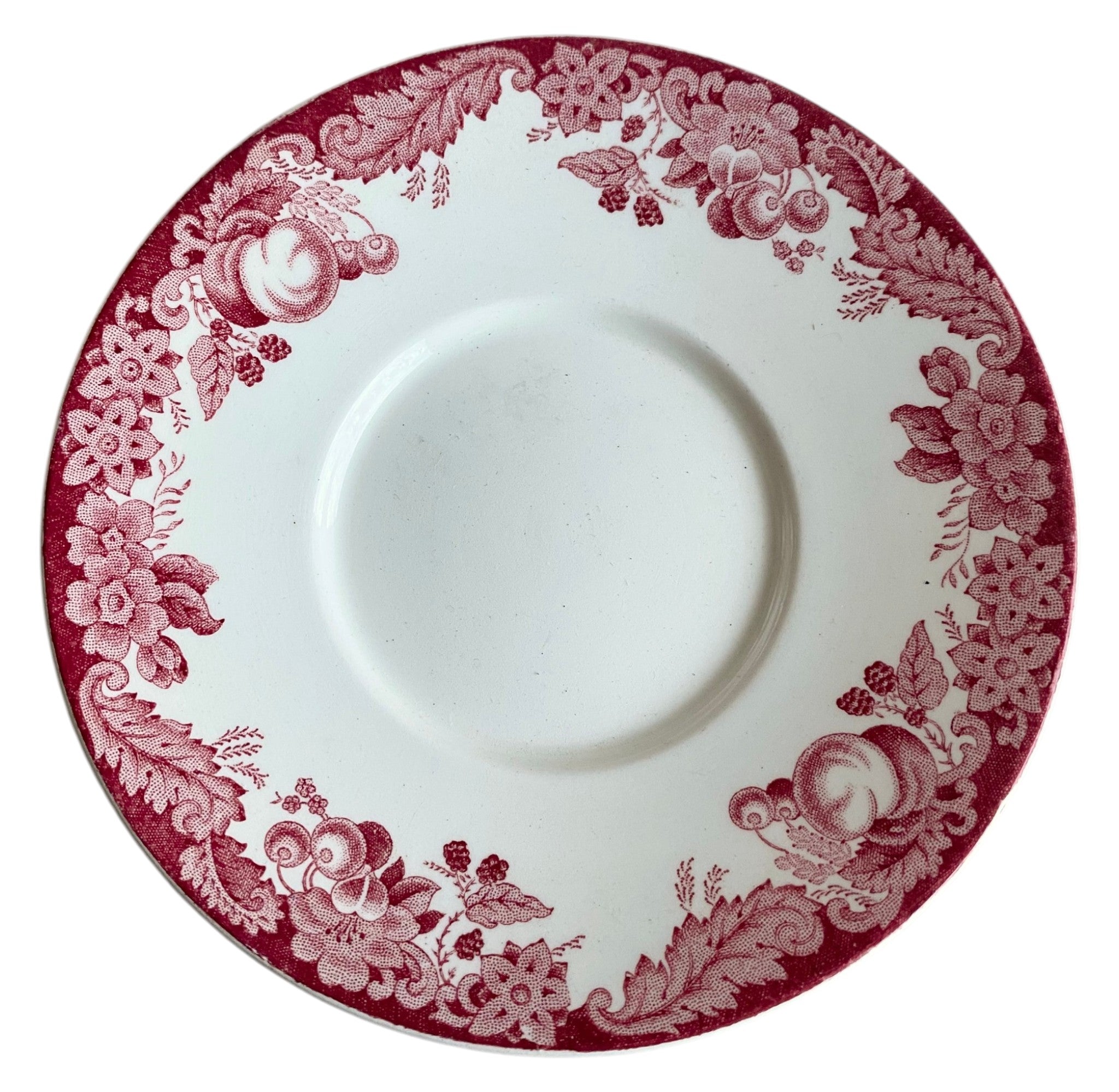 White saucer with red floral pattern on a white background